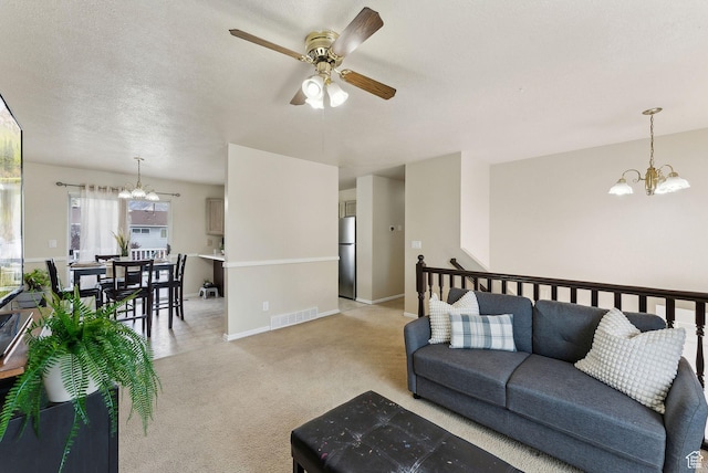 668 N 1370 W, Pleasant Grove, UT 84062 - living room featuring light colored carpet, baseboards, visible vents, and ceiling fan with notable chandelier