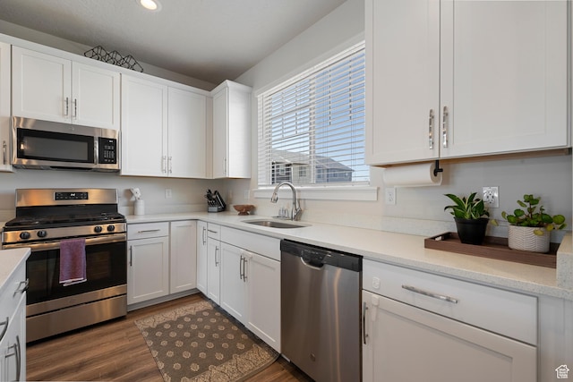 1940 S 200 W Unit 16, Bountiful, UT 84010 - kitchen featuring a sink, appliances with stainless steel finishes, white cabinets, and dark wood-style floors