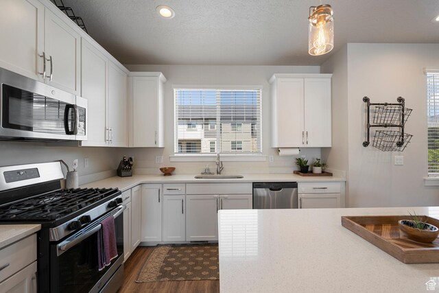 1940 S 200 W Unit 16, Bountiful, UT 84010 - kitchen featuring light countertops, stainless steel appliances, a wealth of natural light, and a sink