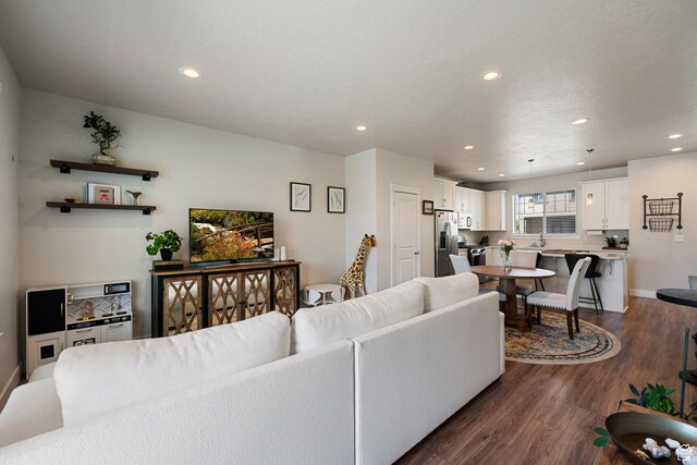 1940 S 200 W Unit 16, Bountiful, UT 84010 - living room featuring recessed lighting, baseboards, and dark wood-type flooring