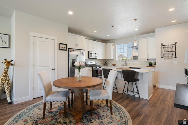 1940 S 200 W Unit 16, Bountiful, UT 84010 - dining area featuring recessed lighting, baseboards, and dark wood-style floors