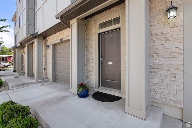 1940 S 200 W Unit 16, Bountiful, UT 84010 - doorway to property featuring board and batten siding and an attached garage