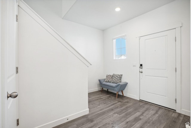 entryway with light wood-type flooring, recessed lighting, and baseboards