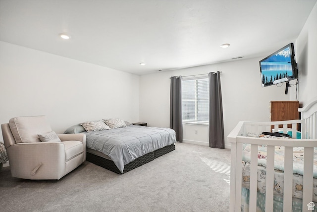 bedroom featuring recessed lighting, light colored carpet, and visible vents