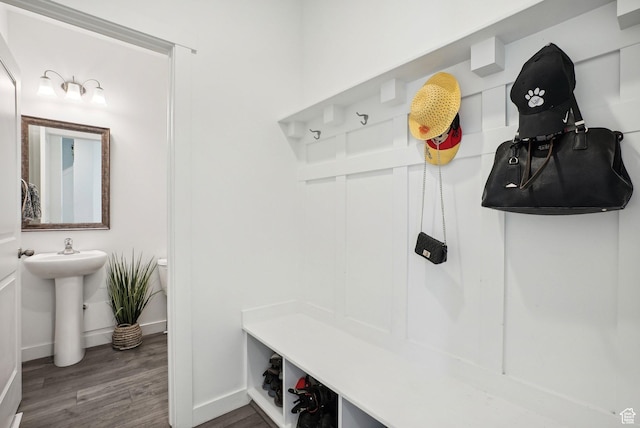mudroom with baseboards and wood finished floors