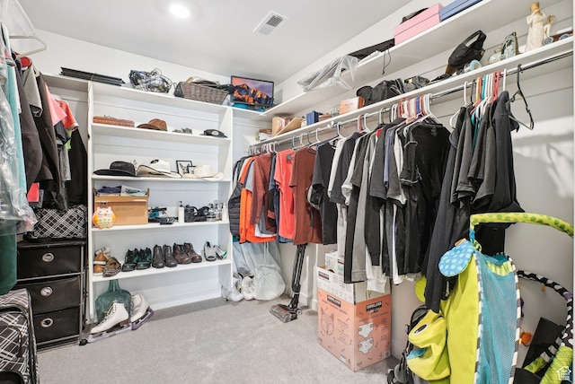spacious closet with carpet floors and visible vents