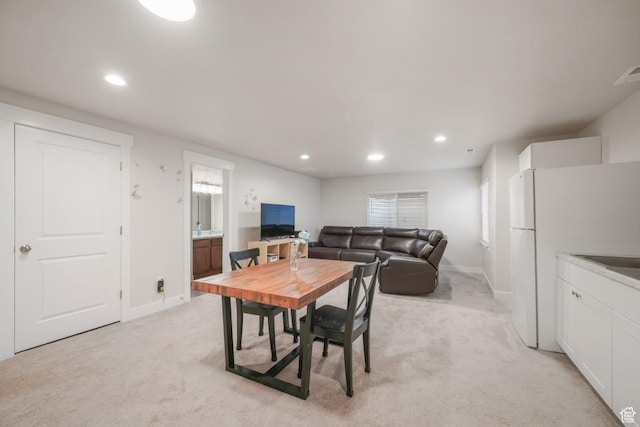 4576 W Sentry Dr, Riverton, UT 84096 - dining space with light colored carpet, recessed lighting, and baseboards