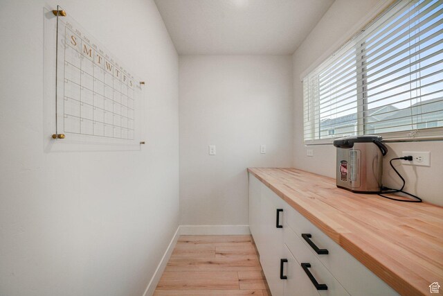 4576 W Sentry Dr, Riverton, UT 84096 - clothes washing area featuring light wood finished floors and baseboards
