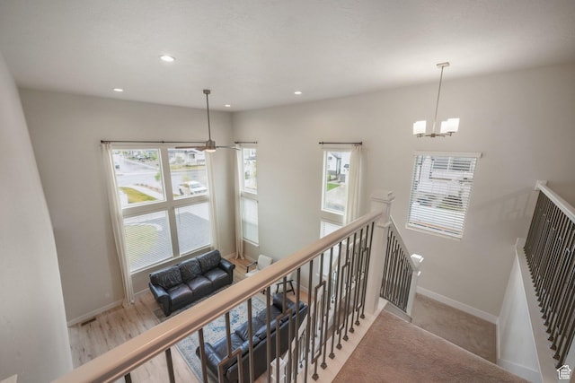 4576 W Sentry Dr, Riverton, UT 84096 - stairway featuring a chandelier, baseboards, and recessed lighting