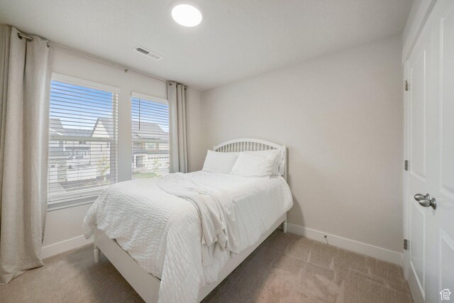 4576 W Sentry Dr, Riverton, UT 84096 - bedroom with light carpet and baseboards