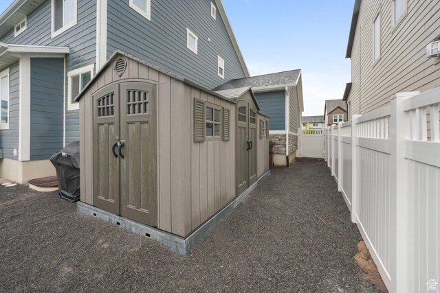 4576 W Sentry Dr, Riverton, UT 84096 - view of shed with a fenced backyard