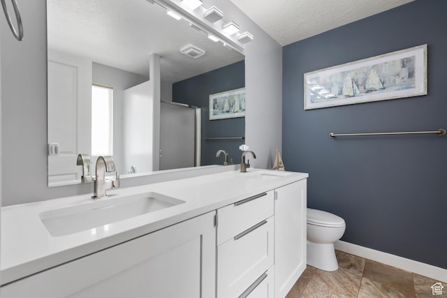 869 N Petro Dr W, Tooele, UT 84074 - full bathroom with double vanity, toilet, a sink, and a stall shower