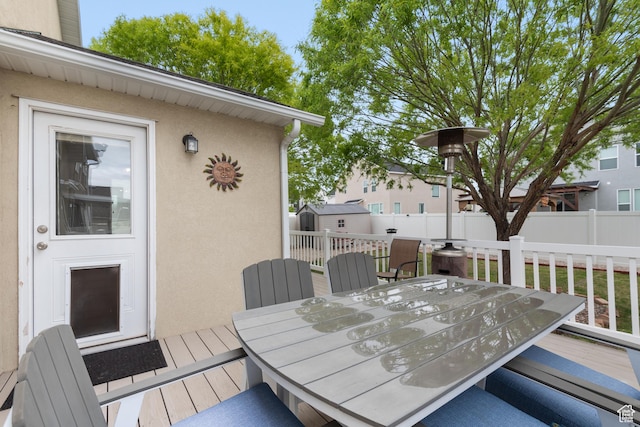 869 N Petro Dr W, Tooele, UT 84074 - deck with an outbuilding, fence, a storage shed, and outdoor dining space