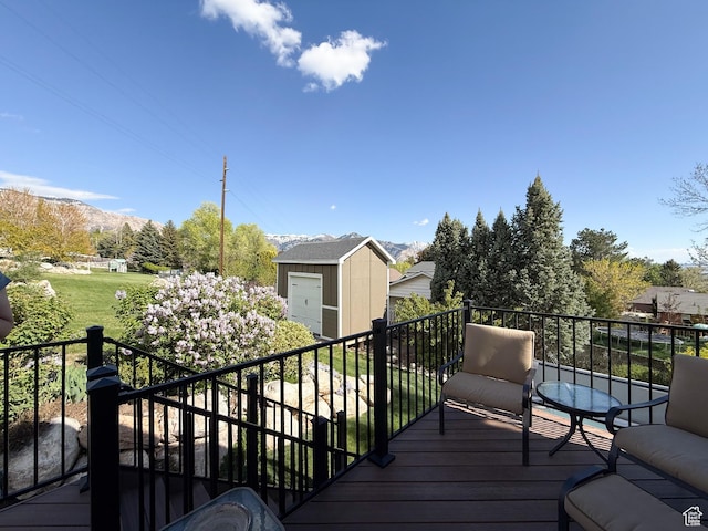 4116 N 800 W, Pleasant View, UT 84414 - wooden terrace with a mountain view, a shed, and an outbuilding