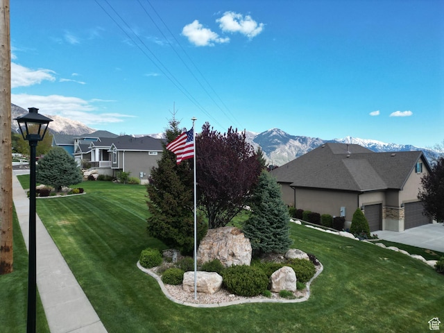 4116 N 800 W, Pleasant View, UT 84414 - view of yard featuring a garage and a mountain view
