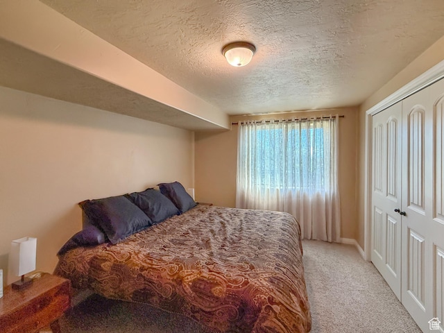 4116 N 800 W, Pleasant View, UT 84414 - bedroom featuring carpet floors, a textured ceiling, baseboards, and a closet