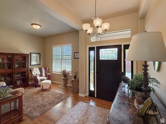 4116 N 800 W, Pleasant View, UT 84414 - foyer with baseboards, wood finished floors, and a chandelier