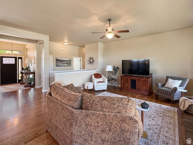 4116 N 800 W, Pleasant View, UT 84414 - living room featuring baseboards, ceiling fan with notable chandelier, and wood finished floors