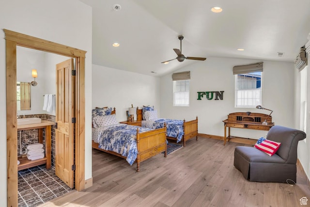 bedroom featuring baseboards, vaulted ceiling, recessed lighting, and wood finished floors