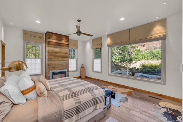 bedroom featuring baseboards, recessed lighting, and visible vents