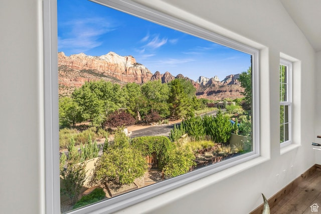 interior space with baseboards and a mountain view