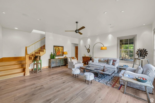 living area featuring wood-type flooring, recessed lighting, ceiling fan, and stairs