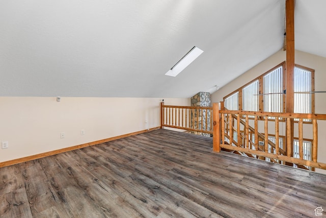 609 E 900 S, Stockton, UT 84071 - additional living space featuring baseboards, wood finished floors, and vaulted ceiling with skylight