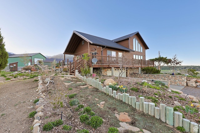 609 E 900 S, Stockton, UT 84071 - view of property exterior with dirt driveway, a wooden deck, metal roof, and a garage
