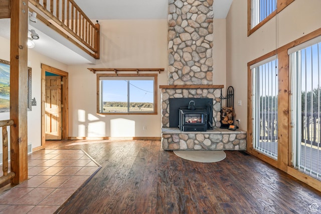 609 E 900 S, Stockton, UT 84071 - unfurnished living room featuring wood finished floors, baseboards, and a high ceiling