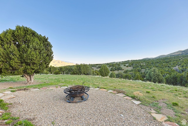 609 E 900 S, Stockton, UT 84071 - view of yard featuring a fire pit and a mountain view