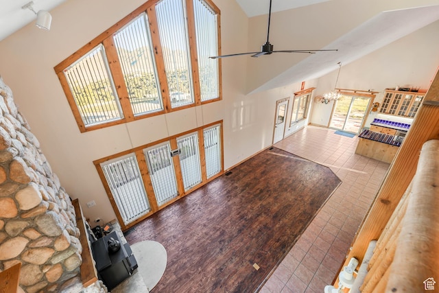 609 E 900 S, Stockton, UT 84071 - tiled living room featuring high vaulted ceiling, french doors, and ceiling fan with notable chandelier