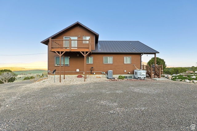 609 E 900 S, Stockton, UT 84071 - rear view of house with central air condition unit, driveway, and metal roof