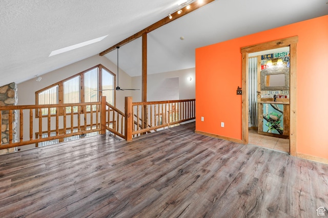 609 E 900 S, Stockton, UT 84071 - additional living space with baseboards, wood finished floors, and vaulted ceiling with skylight