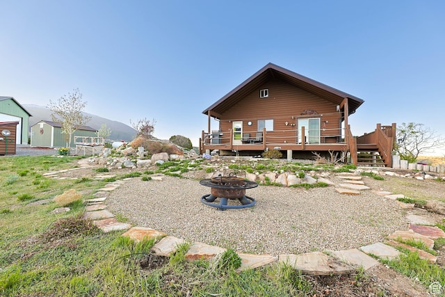609 E 900 S, Stockton, UT 84071 - back of house with stairway, a wooden deck, and an outdoor fire pit