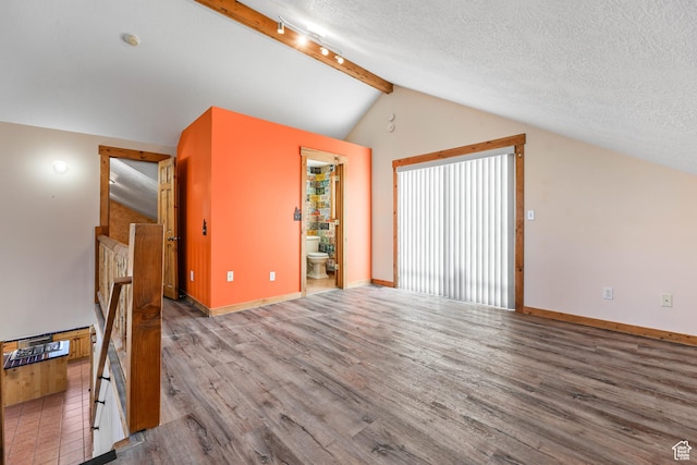 609 E 900 S, Stockton, UT 84071 - additional living space with baseboards, vaulted ceiling with beams, a textured ceiling, and wood finished floors