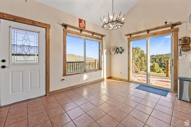 609 E 900 S, Stockton, UT 84071 - tiled foyer featuring baseboards, a wealth of natural light, and a chandelier