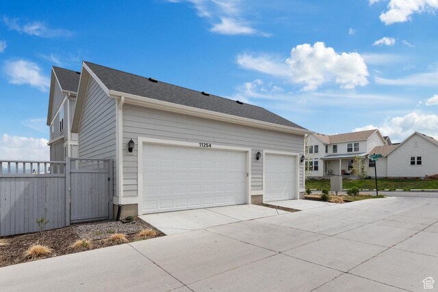 11254 S Bingham Rim Rd W, South Jordan, UT 84009 - view of front of home featuring driveway, a gate, and a residential view