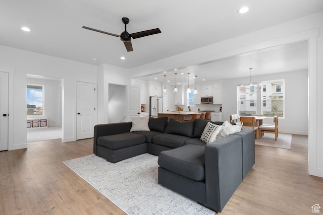 11254 S Bingham Rim Rd W, South Jordan, UT 84009 - living area featuring ceiling fan, light wood-style flooring, baseboards, recessed lighting, and a chandelier
