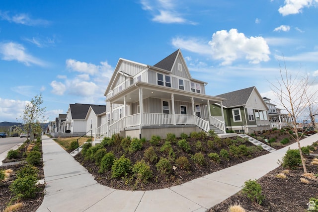 11254 S Bingham Rim Rd W, South Jordan, UT 84009 - view of front of home featuring board and batten siding, a porch, a residential view, and stairs