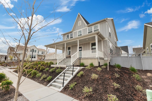 11254 S Bingham Rim Rd W, South Jordan, UT 84009 - view of front facade with board and batten siding, covered porch, stairway, and a residential view