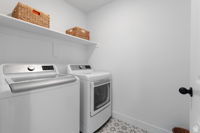 11254 S Bingham Rim Rd W, South Jordan, UT 84009 - washroom featuring separate washer and dryer, baseboards, and light floors