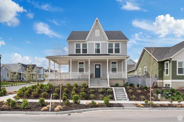 11254 S Bingham Rim Rd W, South Jordan, UT 84009 - view of front facade with board and batten siding, a porch, stairs, a residential view, and a standing seam roof