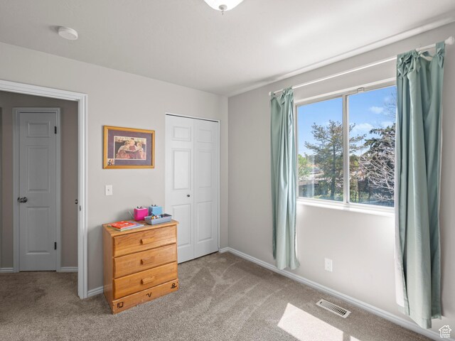 3855 W Elwood Way S, West Jordan, UT 84088 - bedroom featuring a closet, baseboards, light colored carpet, and visible vents