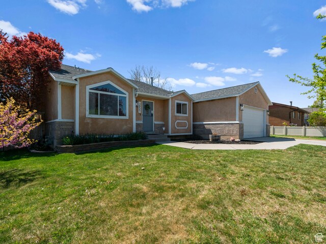 3855 W Elwood Way S, West Jordan, UT 84088 - single story home featuring fence, a front lawn, concrete driveway, an attached garage, and stucco siding