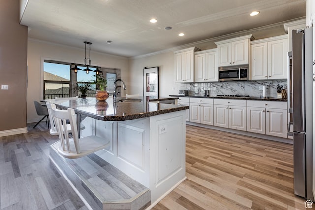 398 S Lofty Ln E, North Salt Lake, UT 84054 - kitchen with a sink, white cabinetry, stainless steel microwave, and ornamental molding