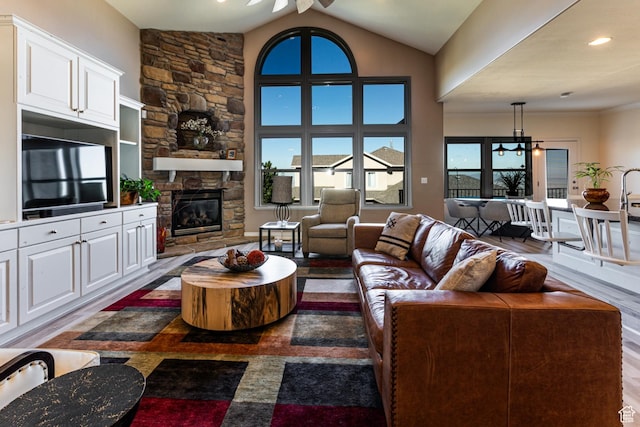 398 S Lofty Ln E, North Salt Lake, UT 84054 - living room with a fireplace, a ceiling fan, and lofted ceiling