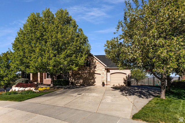 398 S Lofty Ln E, North Salt Lake, UT 84054 - view of property hidden behind natural elements with fence, stone siding, a garage, stucco siding, and concrete driveway