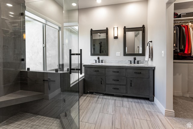 398 S Lofty Ln E, North Salt Lake, UT 84054 - bathroom featuring a sink, double vanity, recessed lighting, and tiled shower