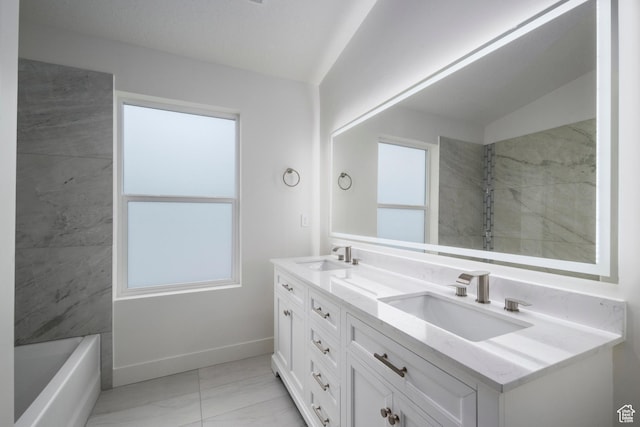 92 N 300 W, American Fork, UT 84003 - full bathroom with marble look tile flooring, double vanity, baseboards, and a tub to relax in