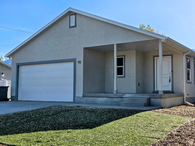 92 N 300 W, American Fork, UT 84003 - ranch-style house with stucco siding, covered porch, an attached garage, and concrete driveway